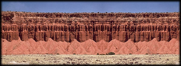 Colorful sandstone cliffs form a picturesque rampart on the Colorado Plateau.