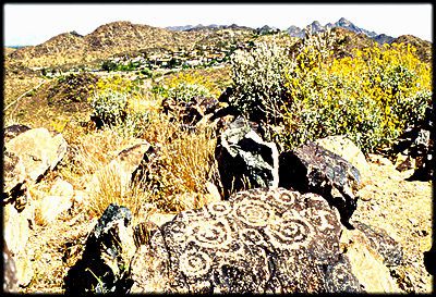 Ancient petroglyphs on a basalt boulder in Phoenix, Arizona.