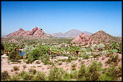 The Papago Buttes, with Camelback Mountain in the background, highlight the Phoenix Zoo's Lake, in this view.
