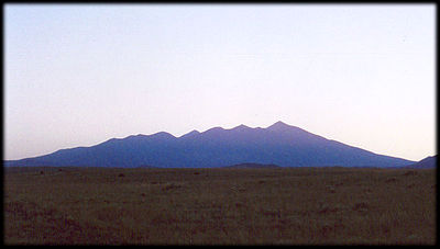 San Francisco Peak, or what is left of it, in silhouette at sunset, from the Northeast.