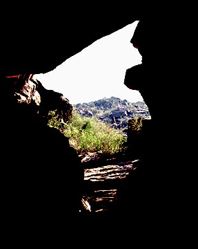 Intense desert sunlight greets the viewer from inside the tunnel on the Hidden Valley Trail.
