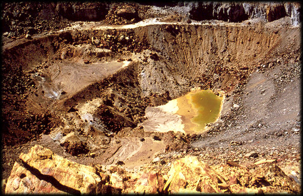 A colorful pool of poisonous water in the old open pit copper mine at Jerome, Arizona.