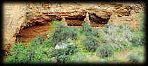 Crumbling stone walls protect some colorful rocks in central Arizona.